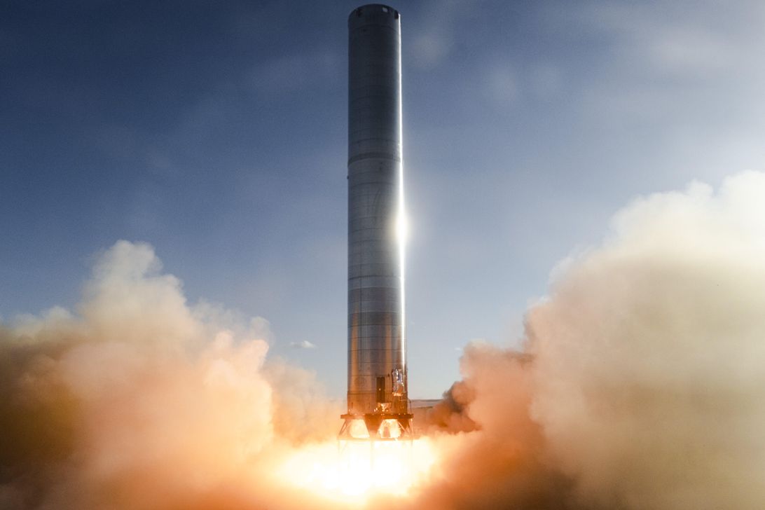 spacex-fires-up-its-super-heavy-starship-rocket-booster-for-the-first-time-cnet